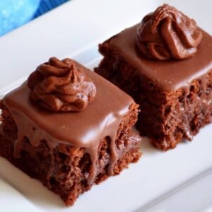 Amandine cake with chocolate glaze and creamy topping, Casa Bake pastry.