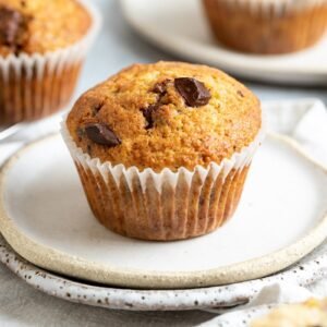 Banana and chocolate chip muffin from Casa Bake in paper liner.