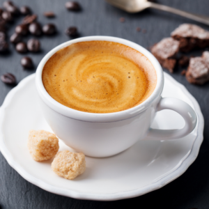 Casa Bake double espresso coffee with latte art and coffee beans