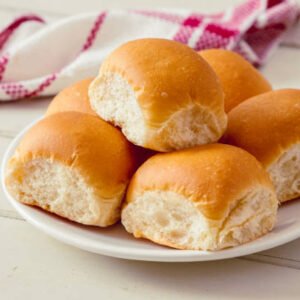 White soft rolls on a plate, Casa Bake bread selection.