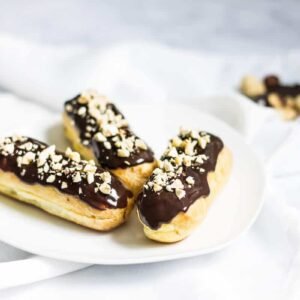 Éclairs pastries from Casa Bake, chocolate glazed and sprinkled with nuts.