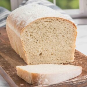 White sourdough bread loaf from Casa Bake, displayed on a wooden board